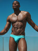 Muscular man wearing CODE 22 Altea 25063 swim briefs against a clear blue sky. CODE 22 ALTEA 25063, Herren Badehose Code 22 Kleidung & Accessoires:Herren:Herrenmode:Bademode nudosz.myshopify.com